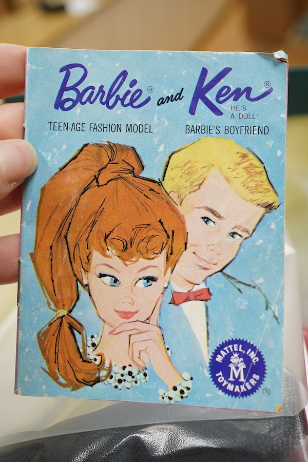 A 1960's Mattel Inc. Barbie doll, 1963, together with a Skipper doll, and a collection of eight original outfits with accessories, sorted into individual packets, outfits purchased between 1963 to 1966 include; American